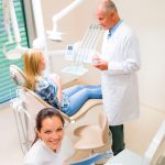 Brickell-Dental-Center_15035991-top-view-of-dental-surgery-professional-team-dentist-consulting-patient