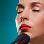 Oribe_13948040-making-up-the-models-face–professional-makeup-artist-working