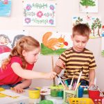 Main-Photo_9392328-children-painting-in-play-room-child-care