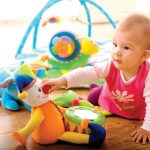 Toy-Town_5943443-baby-girl-9-months-playing-with-soft-toys-at-home-toys-are-property-released