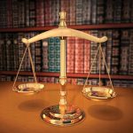Buchanan-Ingersoll_7055169-brass-scales-of-justice-on-a-desk-showing-depth-of-field-books-behind-in-the-background