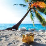 OPENER_10896038-golden-gift-on-ocean-beach-under-palm