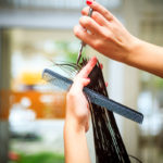 20886768 – hairdresser do haircut close up indoor shot
