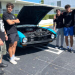 2. Diego Fernandez and some fans of his antique Ford Mustang coupe 1981
