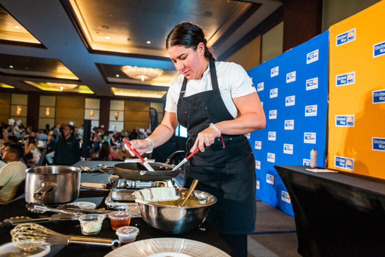 Chef Karla Hoyos showcasing her culinary chops with the crowd