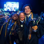 US-grad-teacher-with-students