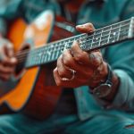 a close up of a person playing a guitar with blurry lights in t