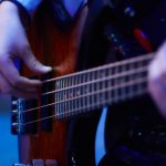girl plaing bass guitar